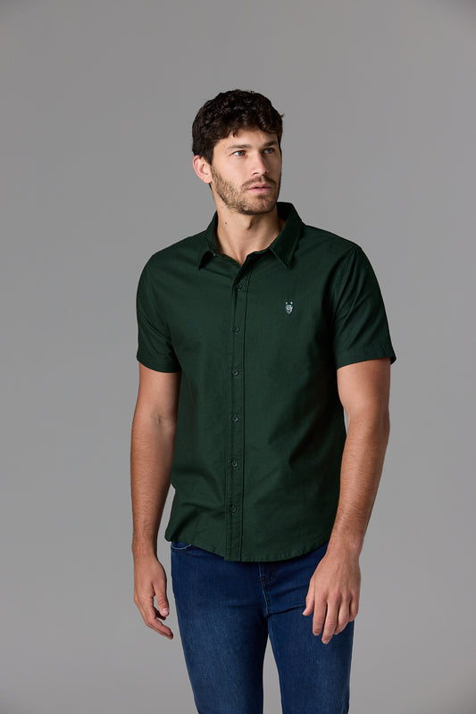 Man wearing a dark green shirt and jeans.