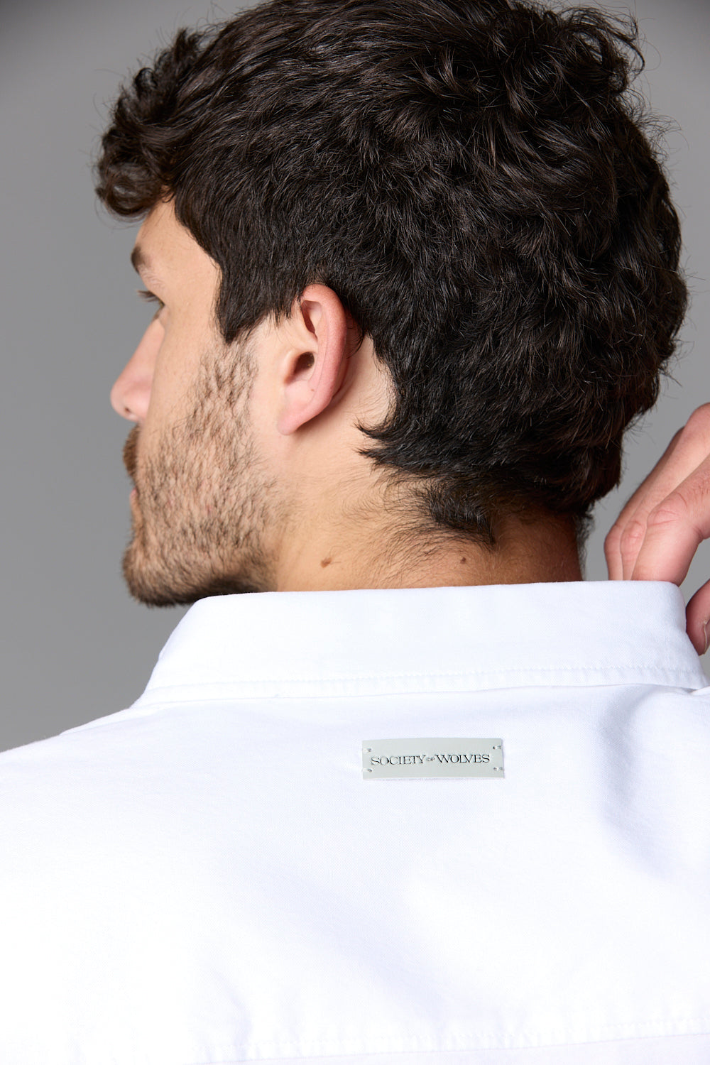 Man in white shirt from behind