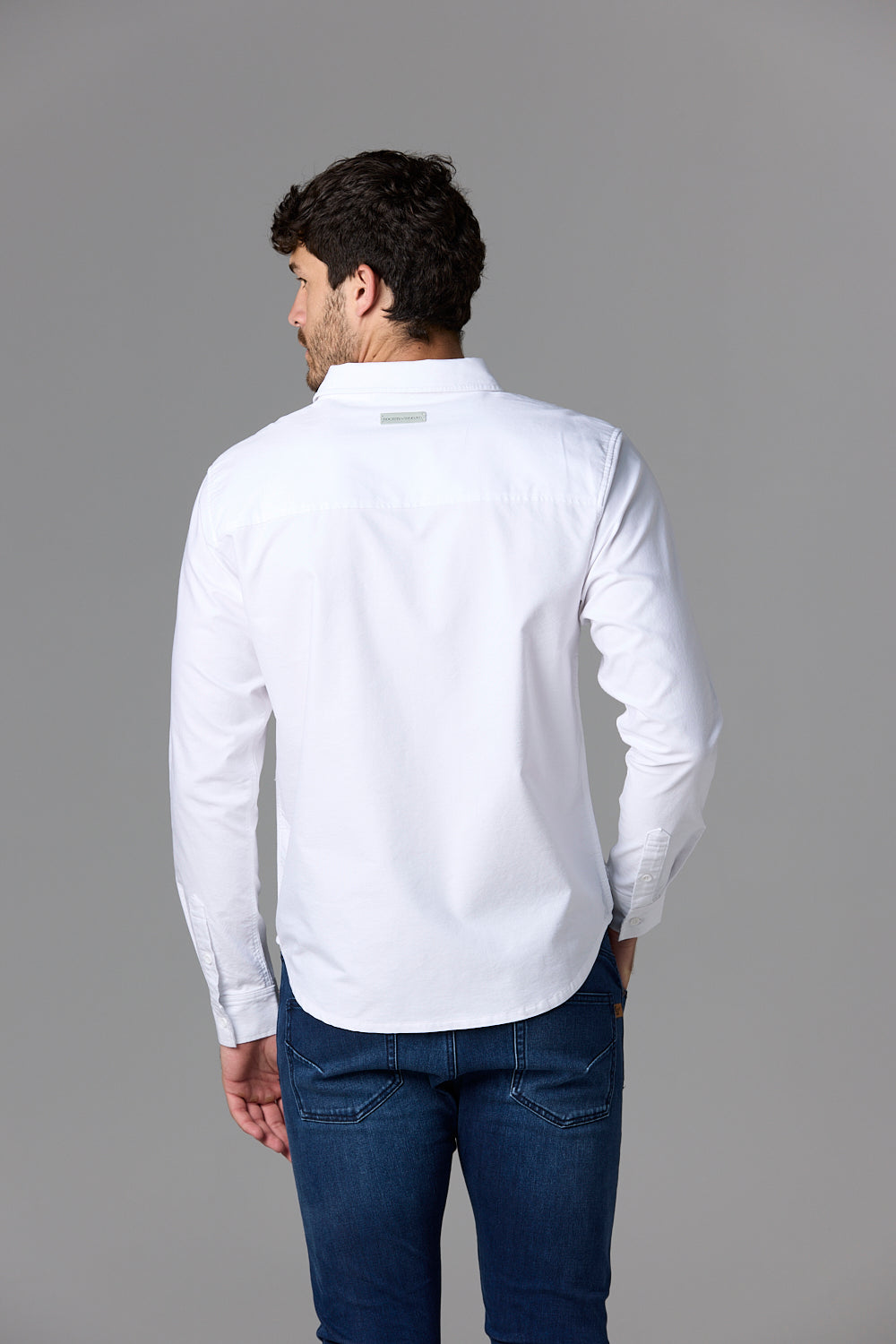 Man wearing white shirt, back view