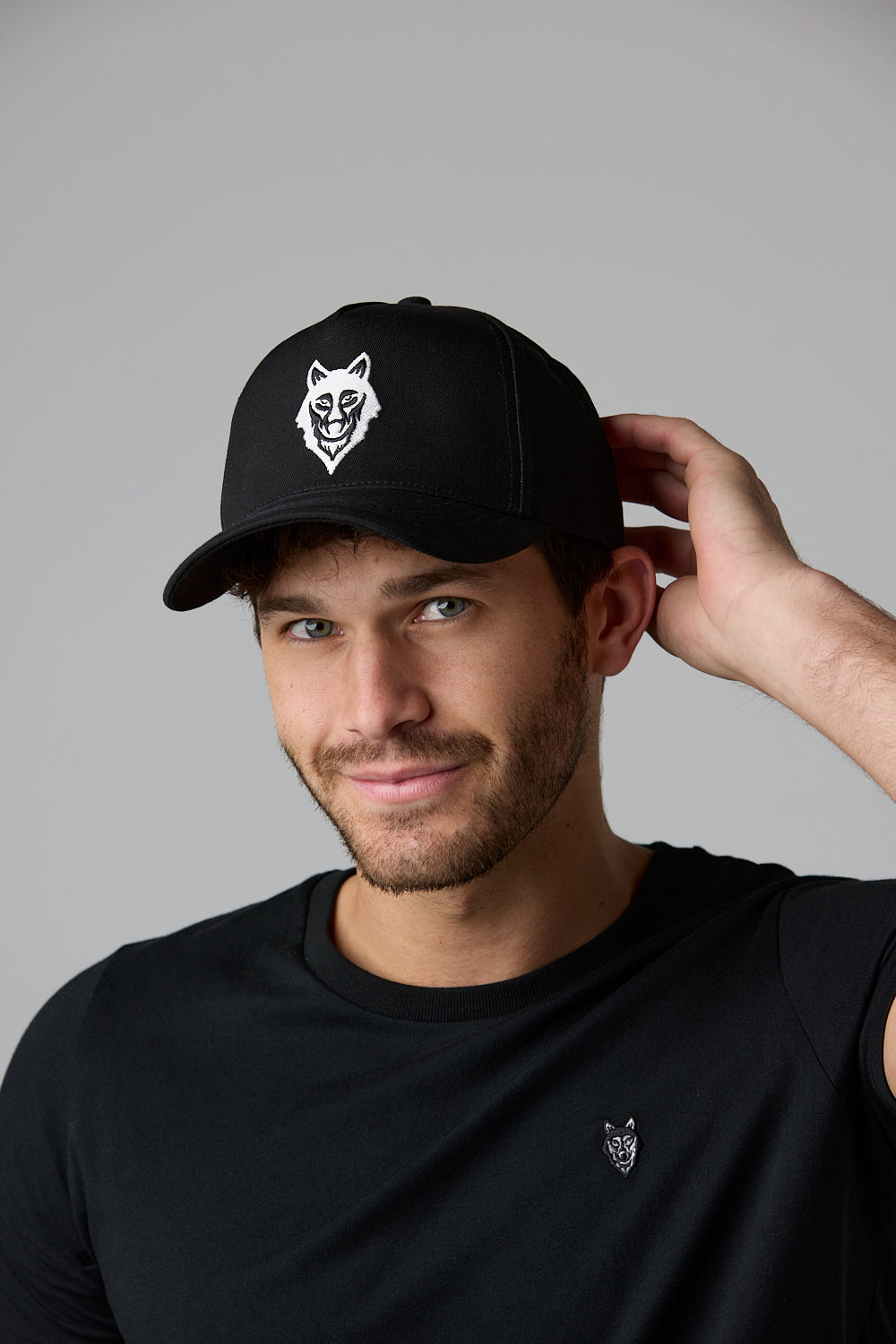 SOW 2 ECOM Wolf Cap - Man wearing black hat and shirt