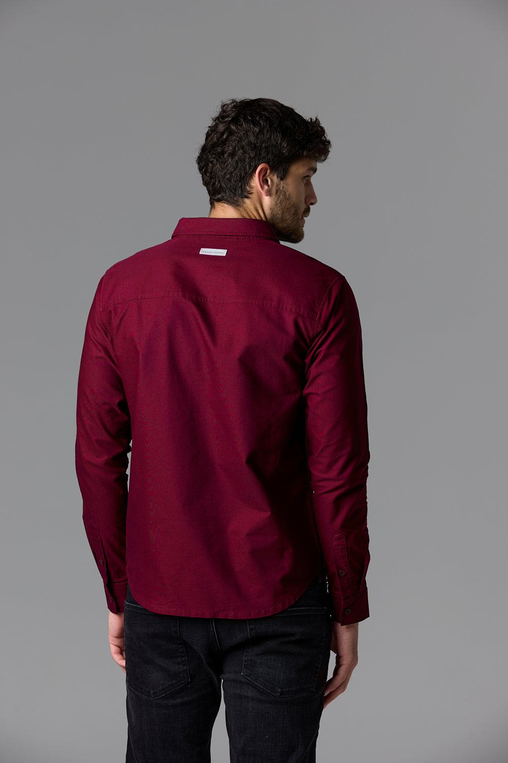 Man in burgundy shirt