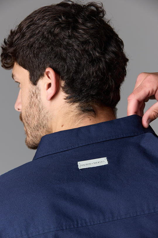 Man in navy shirt, back view