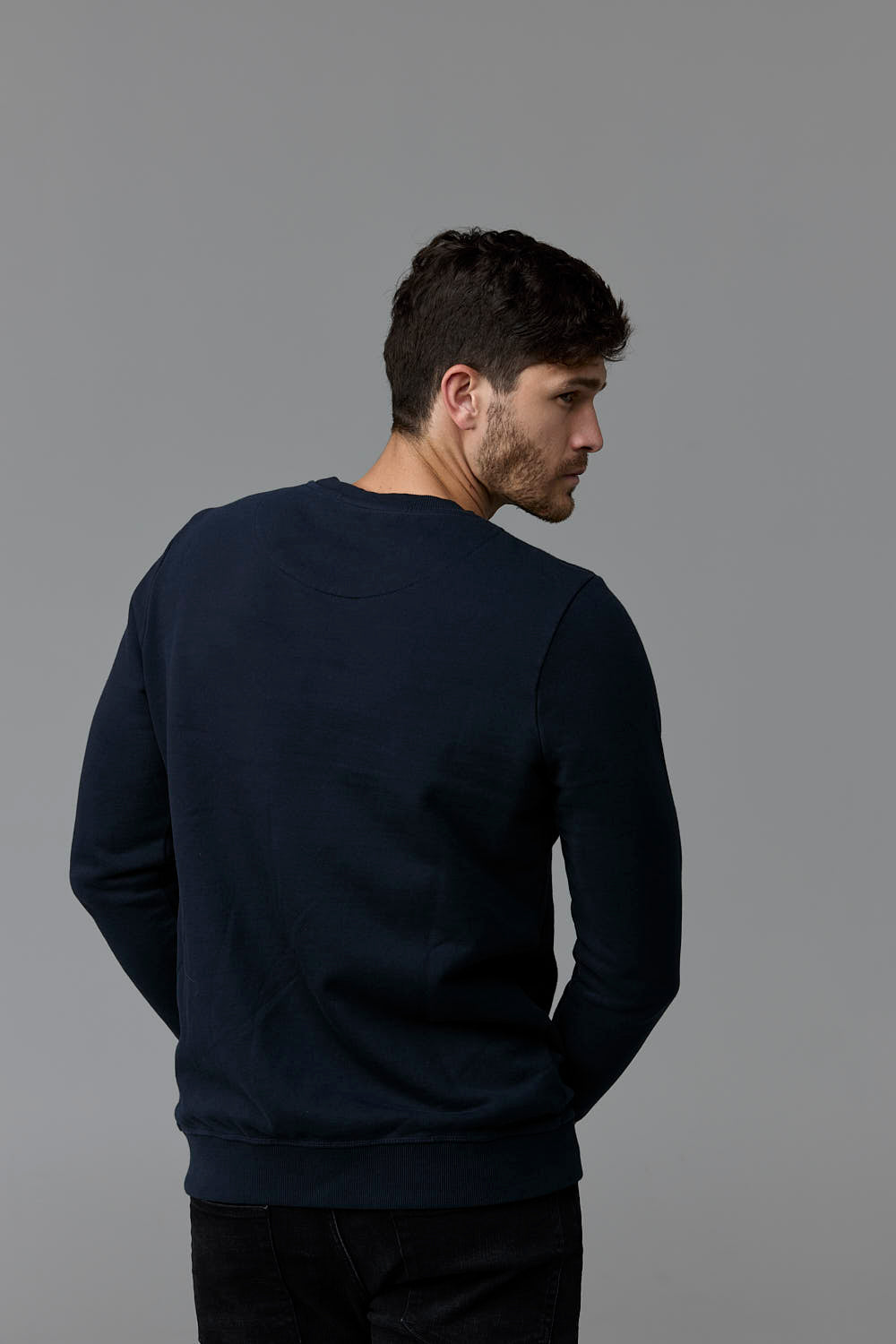 SOW ECOM WEB 17 - Man wearing navy sweatshirt