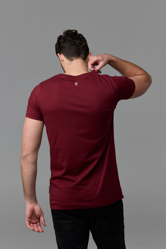 Man in burgundy t-shirt