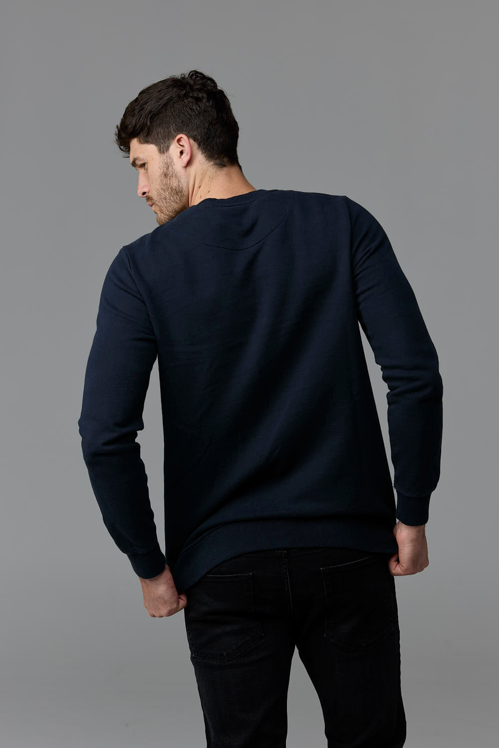SOW ECOM - Man wearing navy sweatshirt