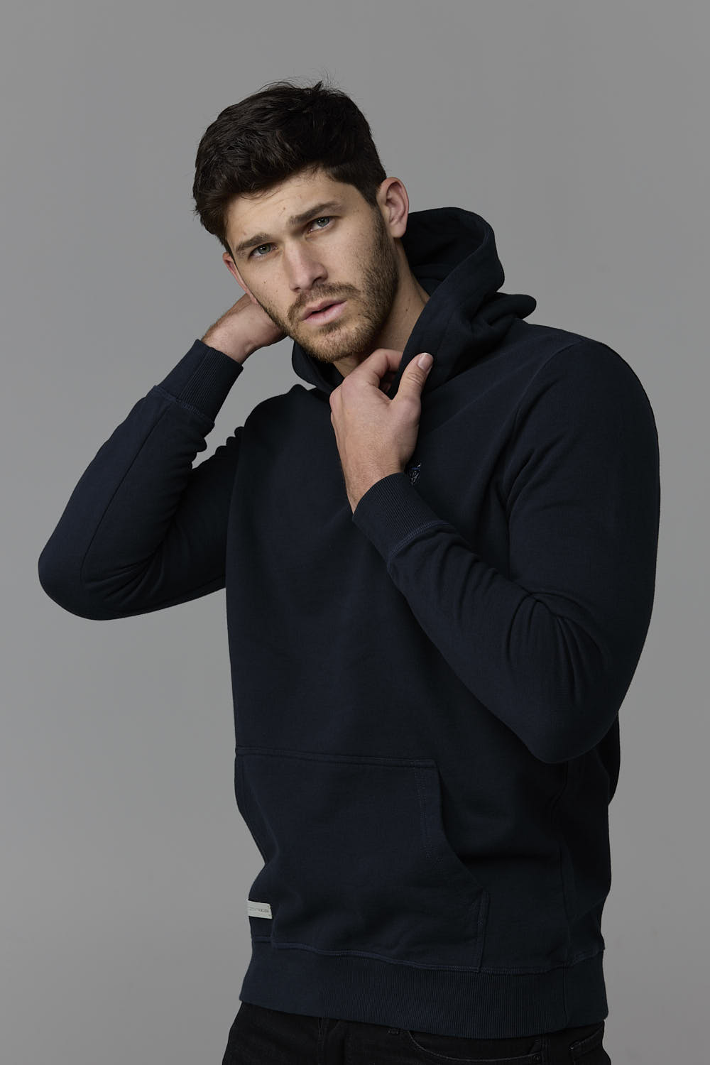 SOW ECOM - Man wearing navy hoodie