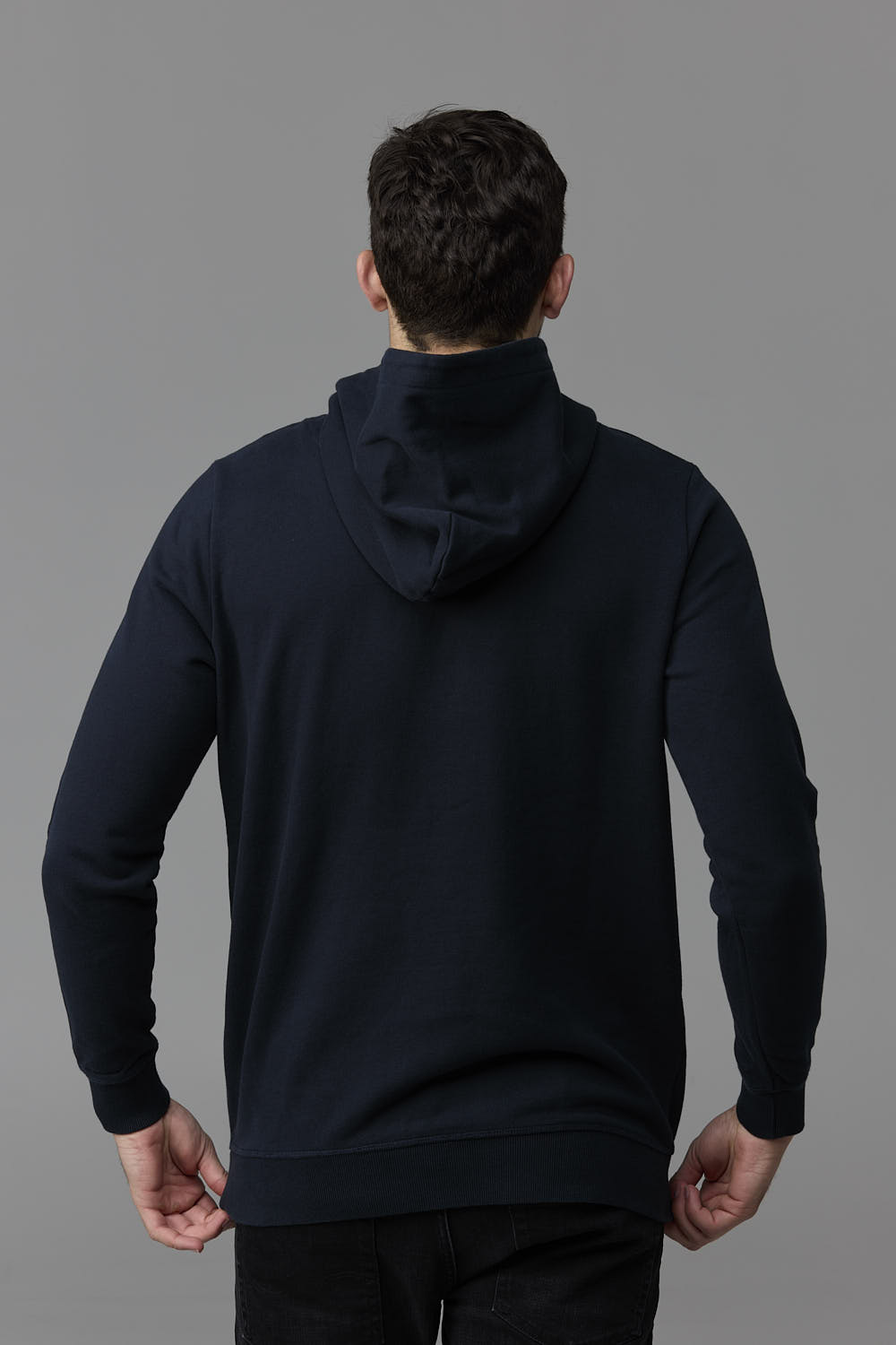 SOW ECOM - Man in navy hoodie from the back