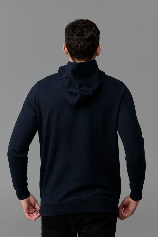 SOW ECOM - Man in navy hoodie from the back