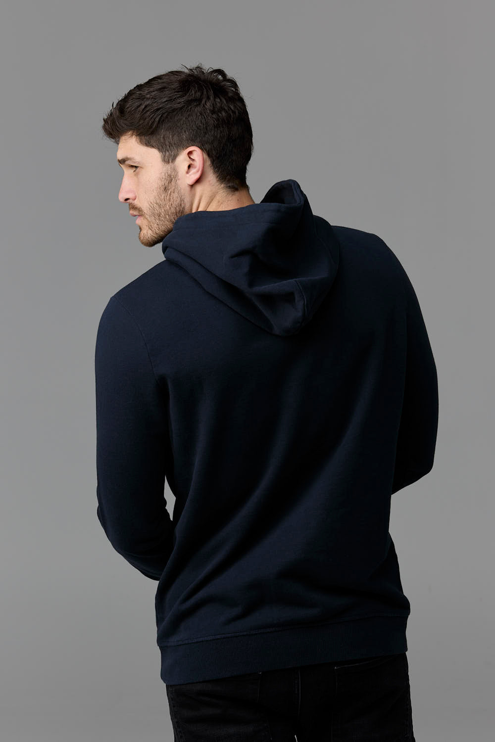 Man wearing navy hoodie