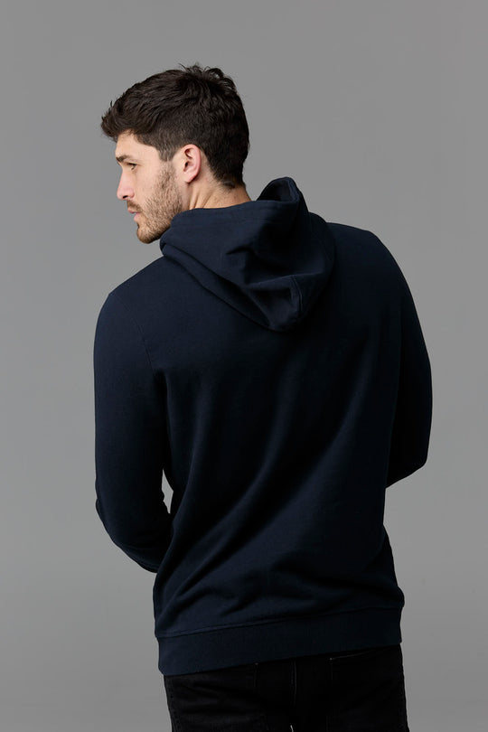 Man wearing navy hoodie