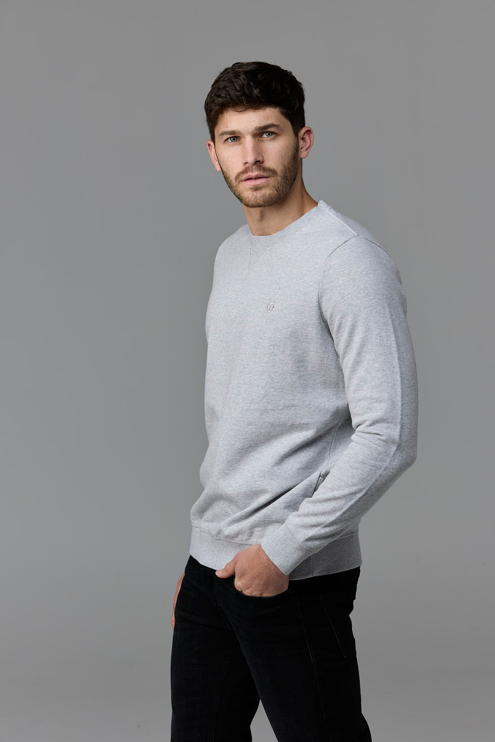 SOW ECOM - Man in light grey sweater & black pants